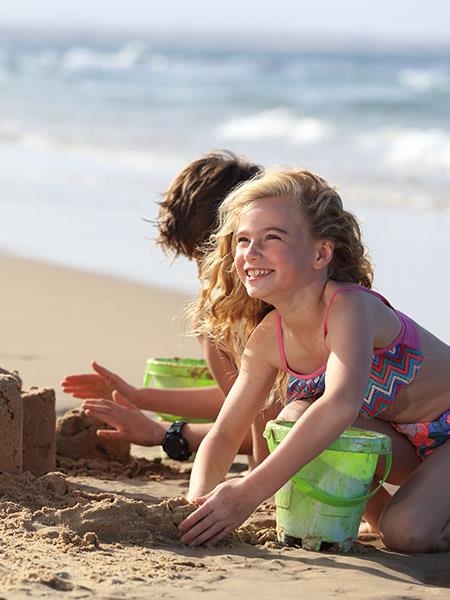 Children building sandcastles on mooloolaba beach